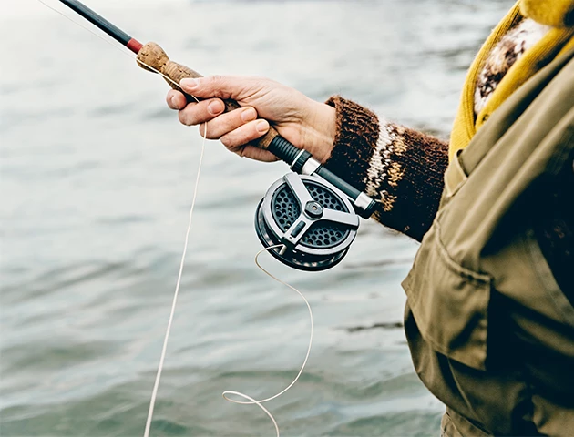 a person holding a fishing rod