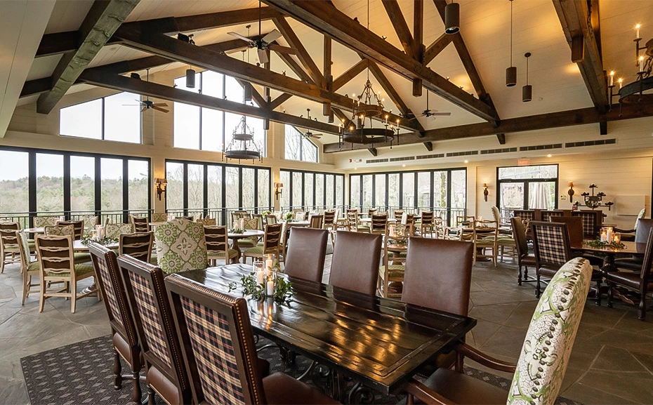 a room with many chairs and tables
