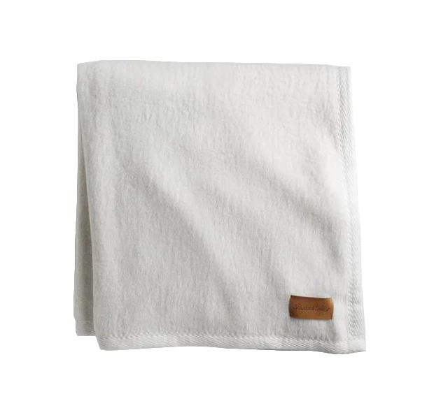 a white towel with a brown label