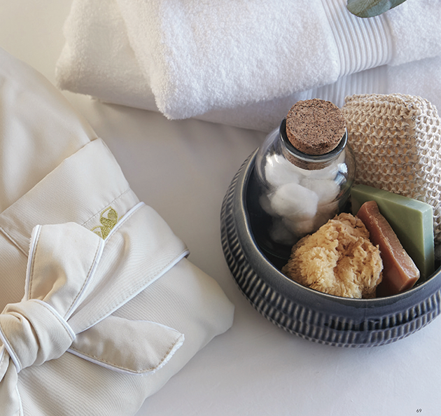 a bowl with soap and a towel