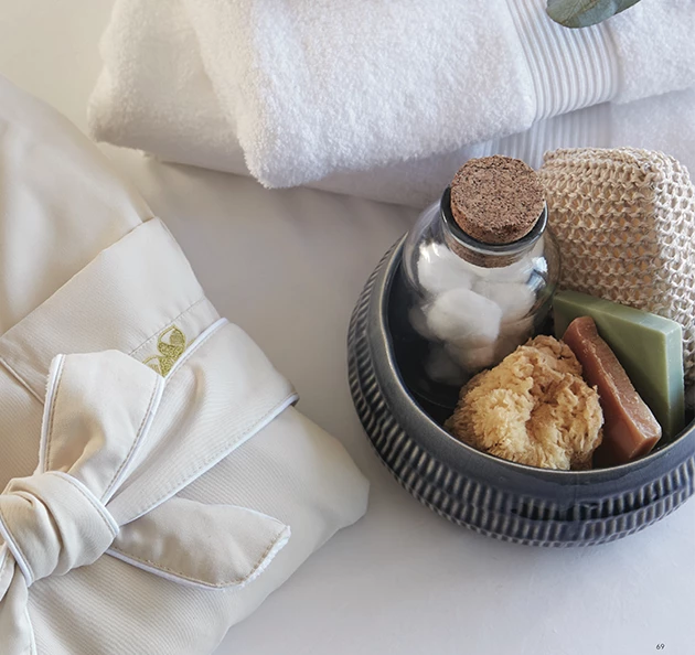 a bowl with soap and a towel