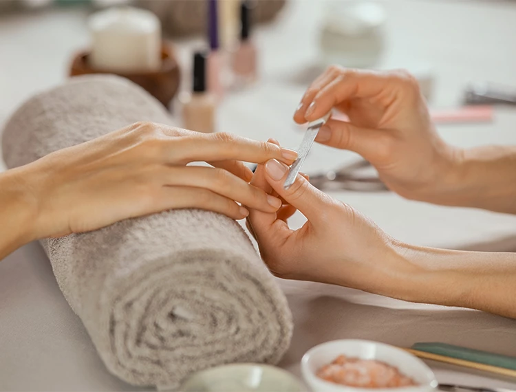 a person getting manicure done