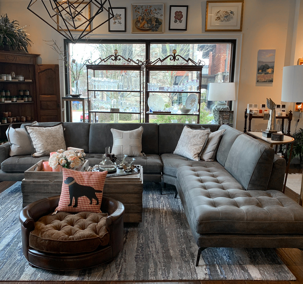 a living room with a large sectional sofa and a coffee table
