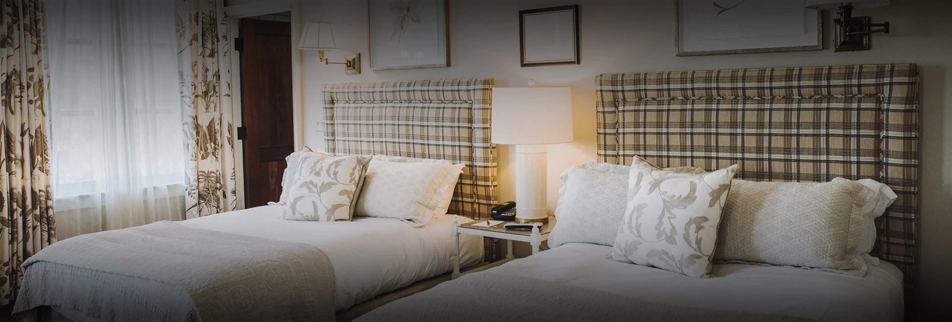 a bed with pillows and a lamp