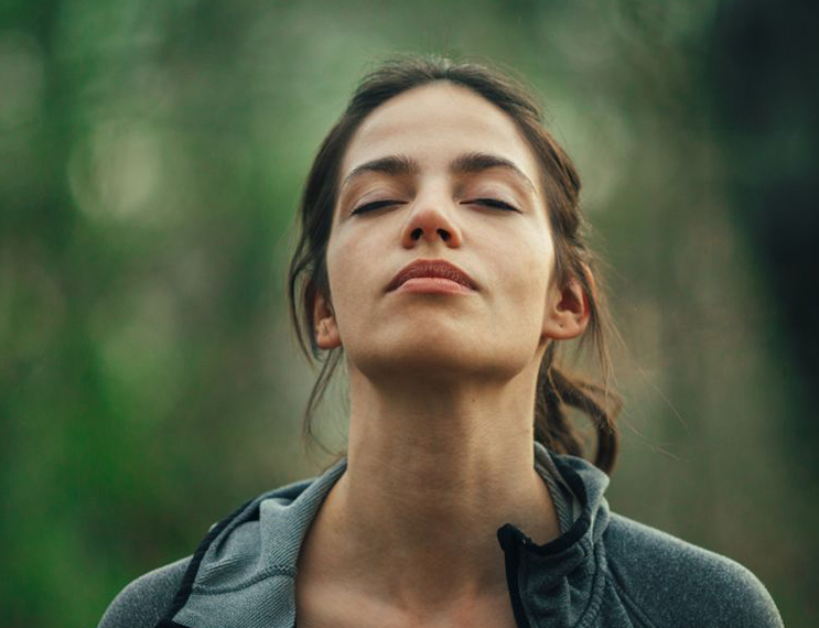 a woman with her eyes closed