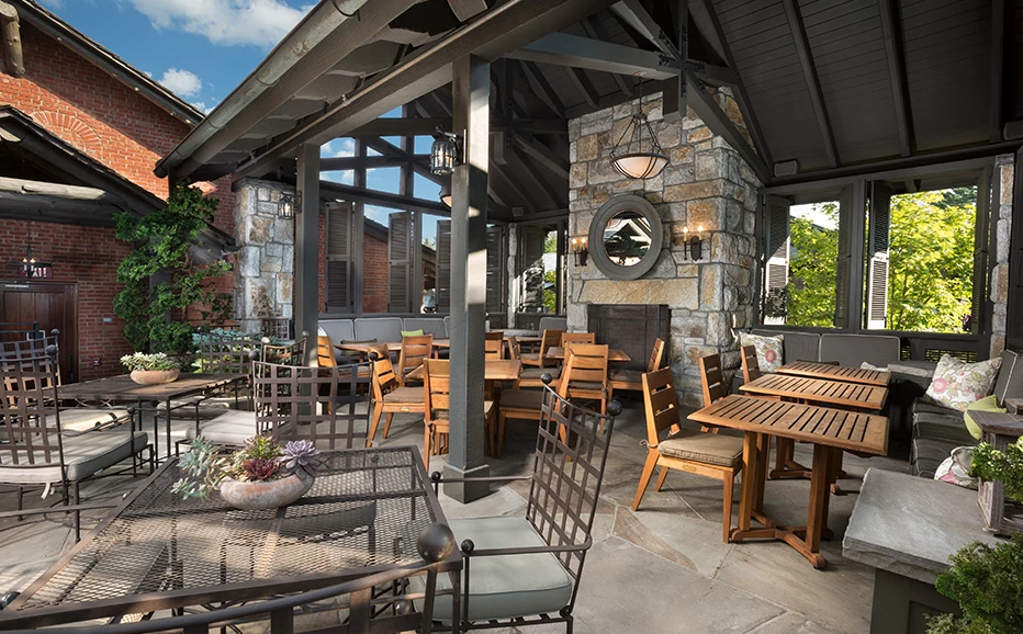 a patio with tables and chairs