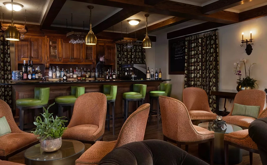 a bar with chairs and a counter