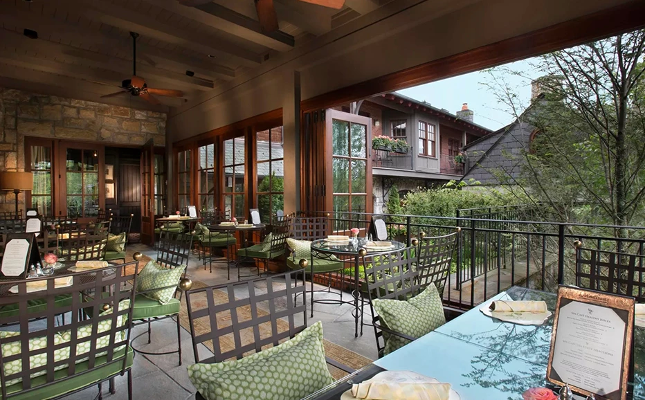 a patio with tables and chairs