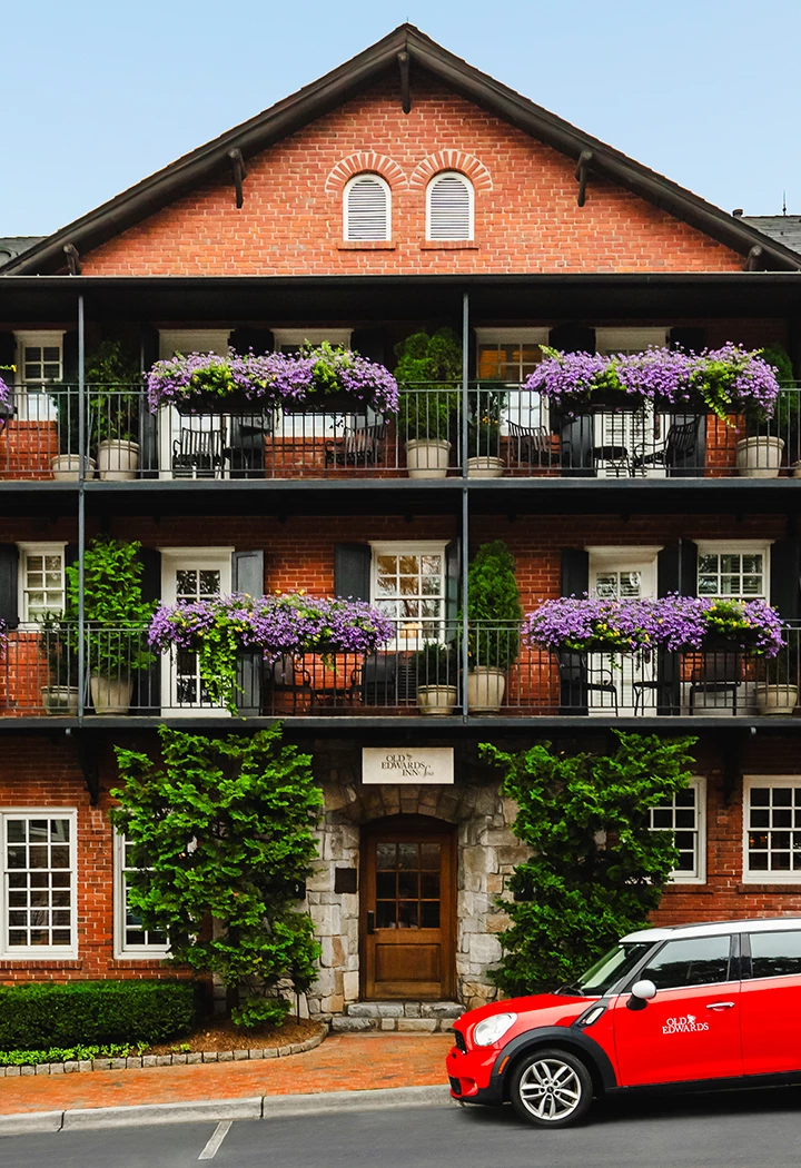 a building with many balconies and flowers