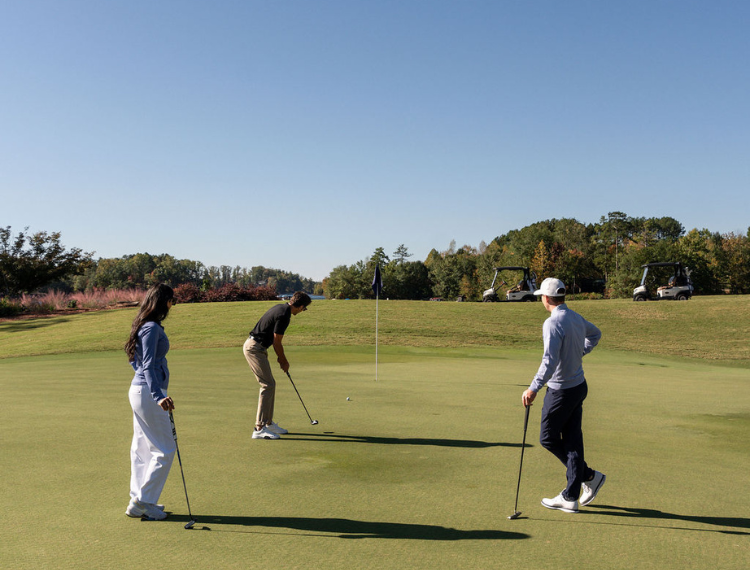 a group of people playing golf