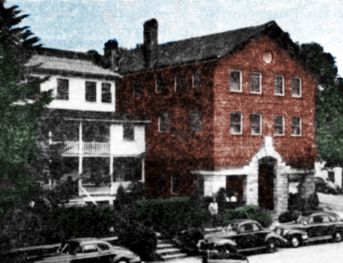 a building with cars parked in front of it