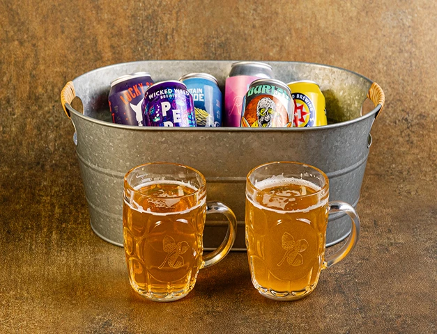 a metal tub full of beer and cans