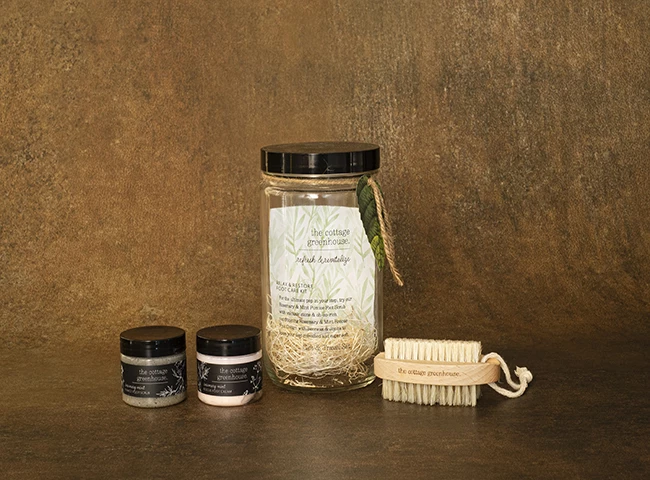 a group of jars and a brush