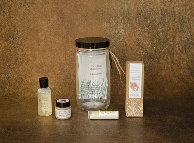 a group of small bottles and a jar