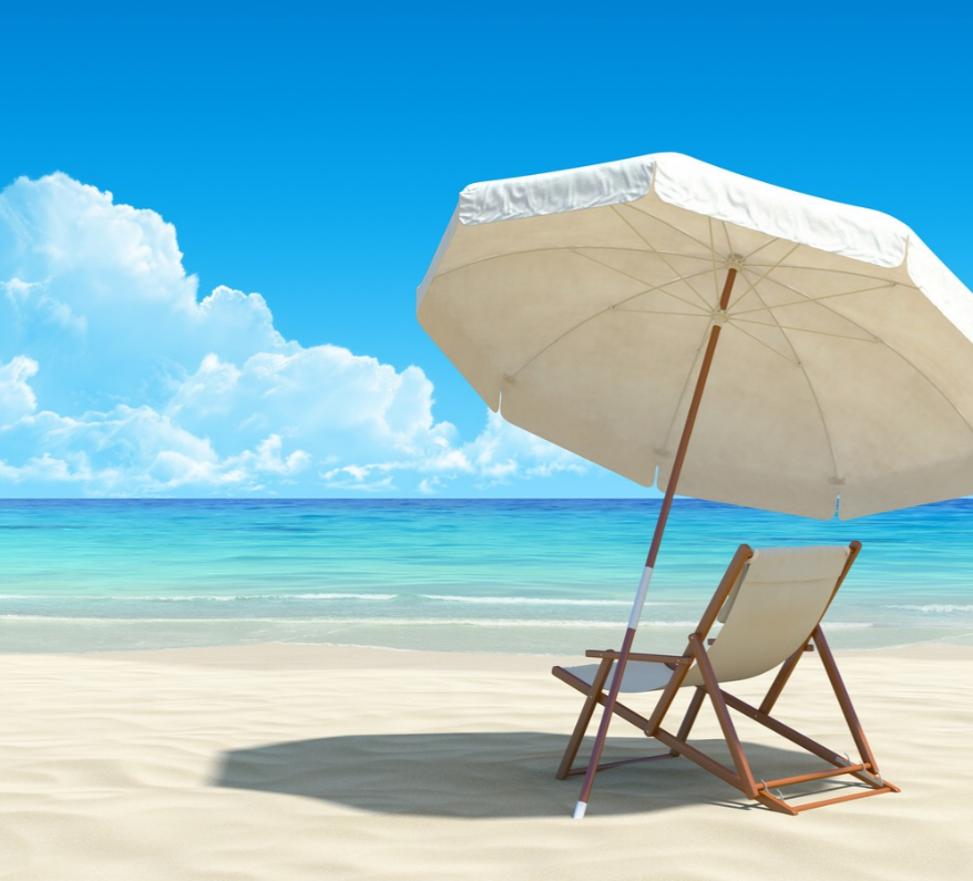 a chair and umbrella on a beach