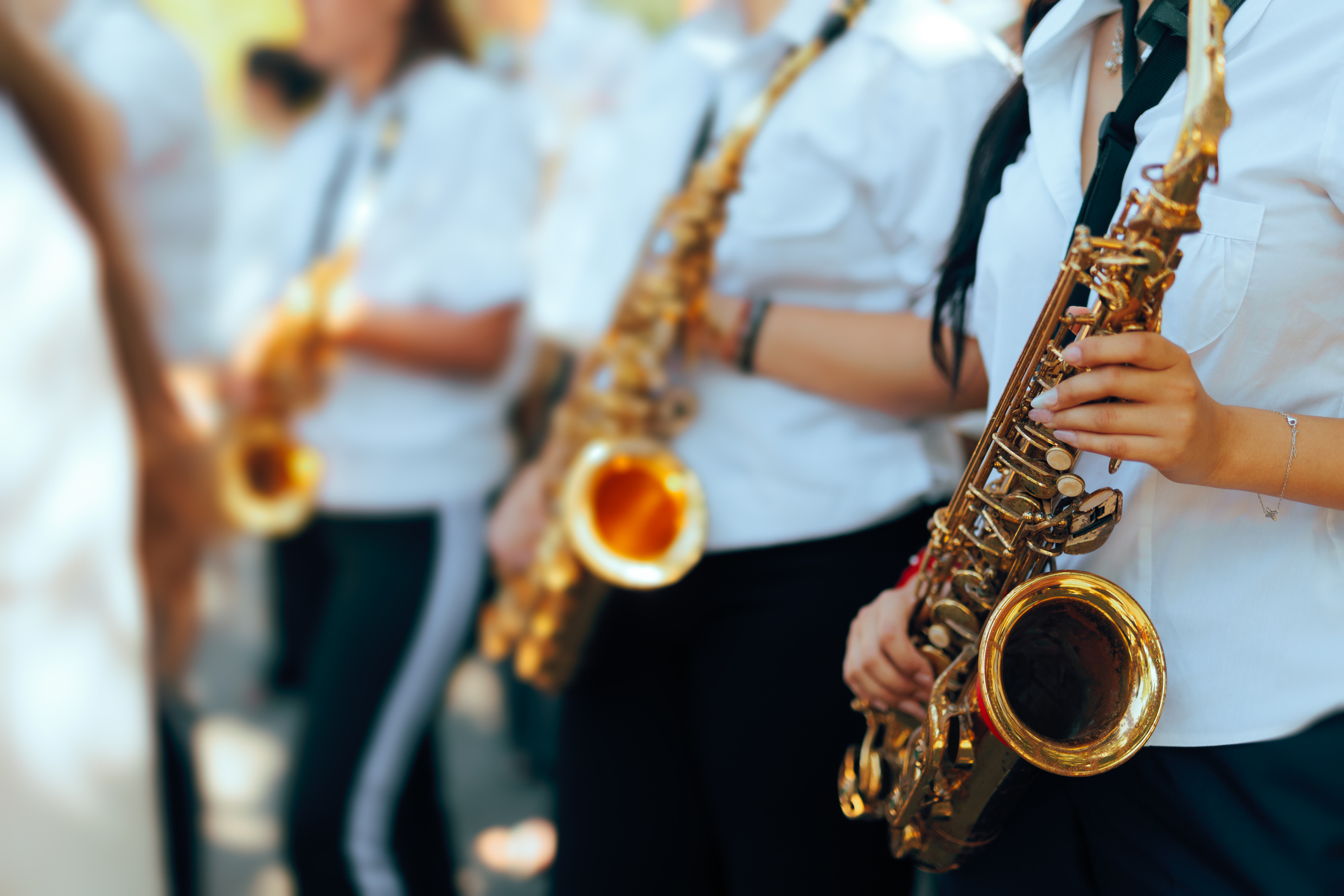 a group of people holding musical instruments