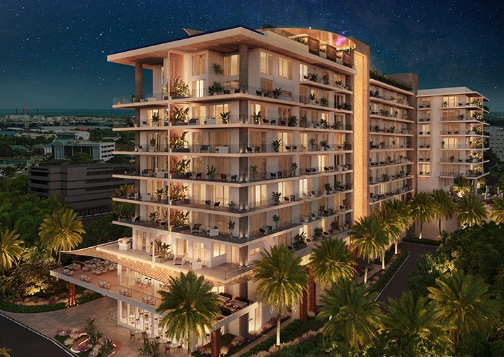 a building with palm trees and a road