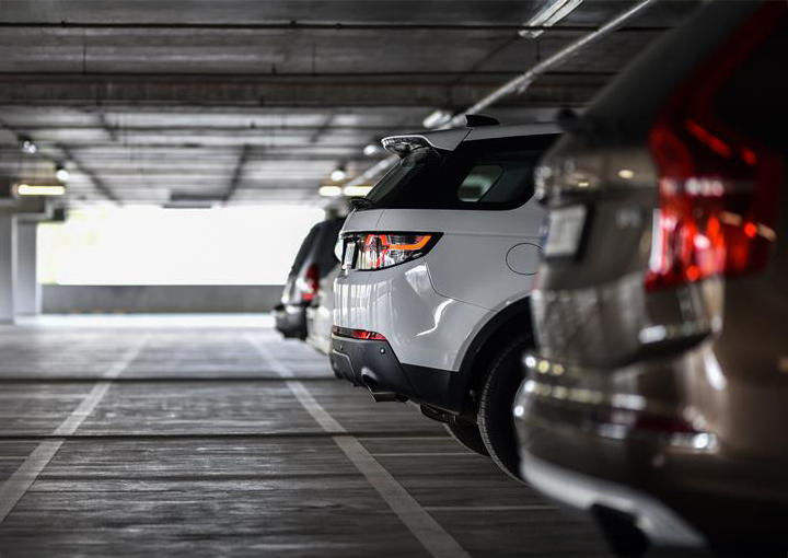 cars parked cars in a parking garage