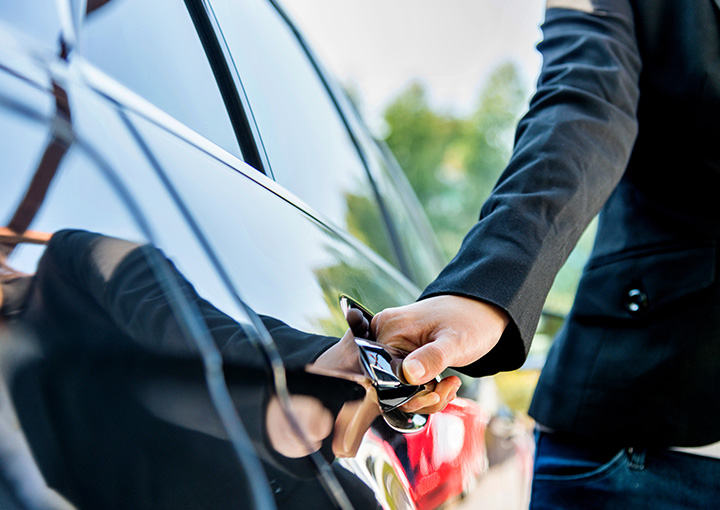 a person opening a car door