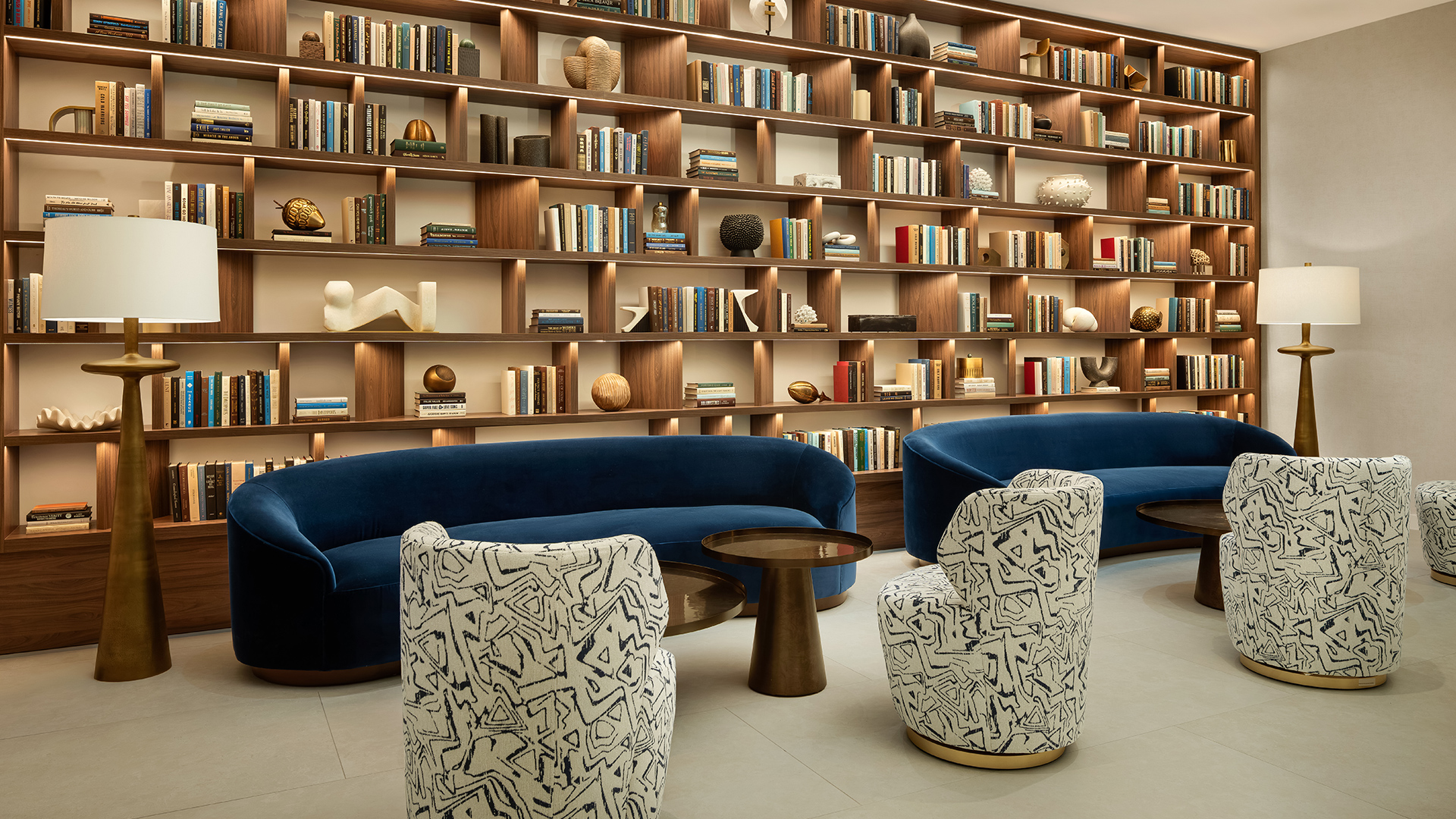 a room with a book shelf and a couch
