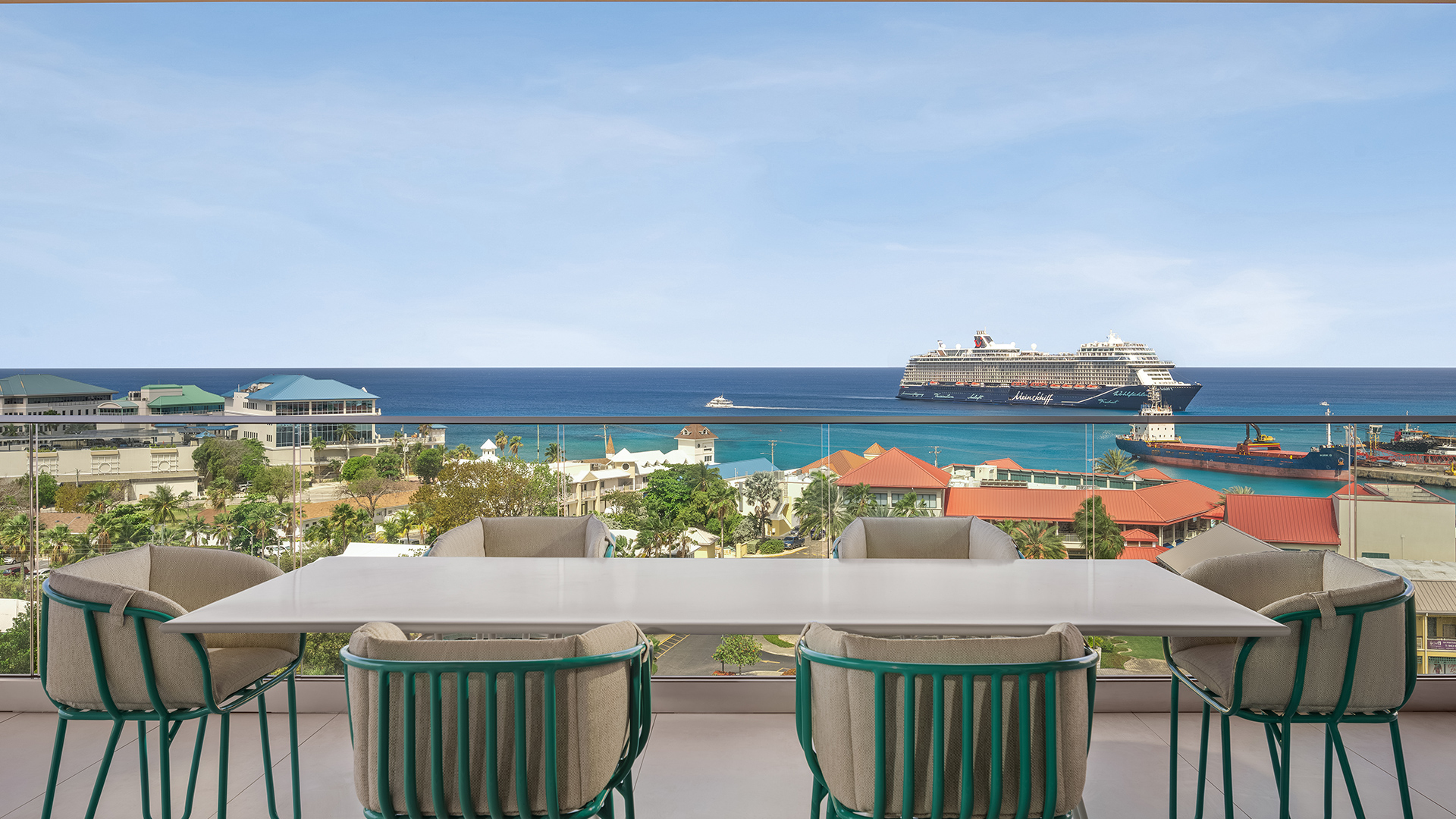 a balcony with a cruise ship in the background