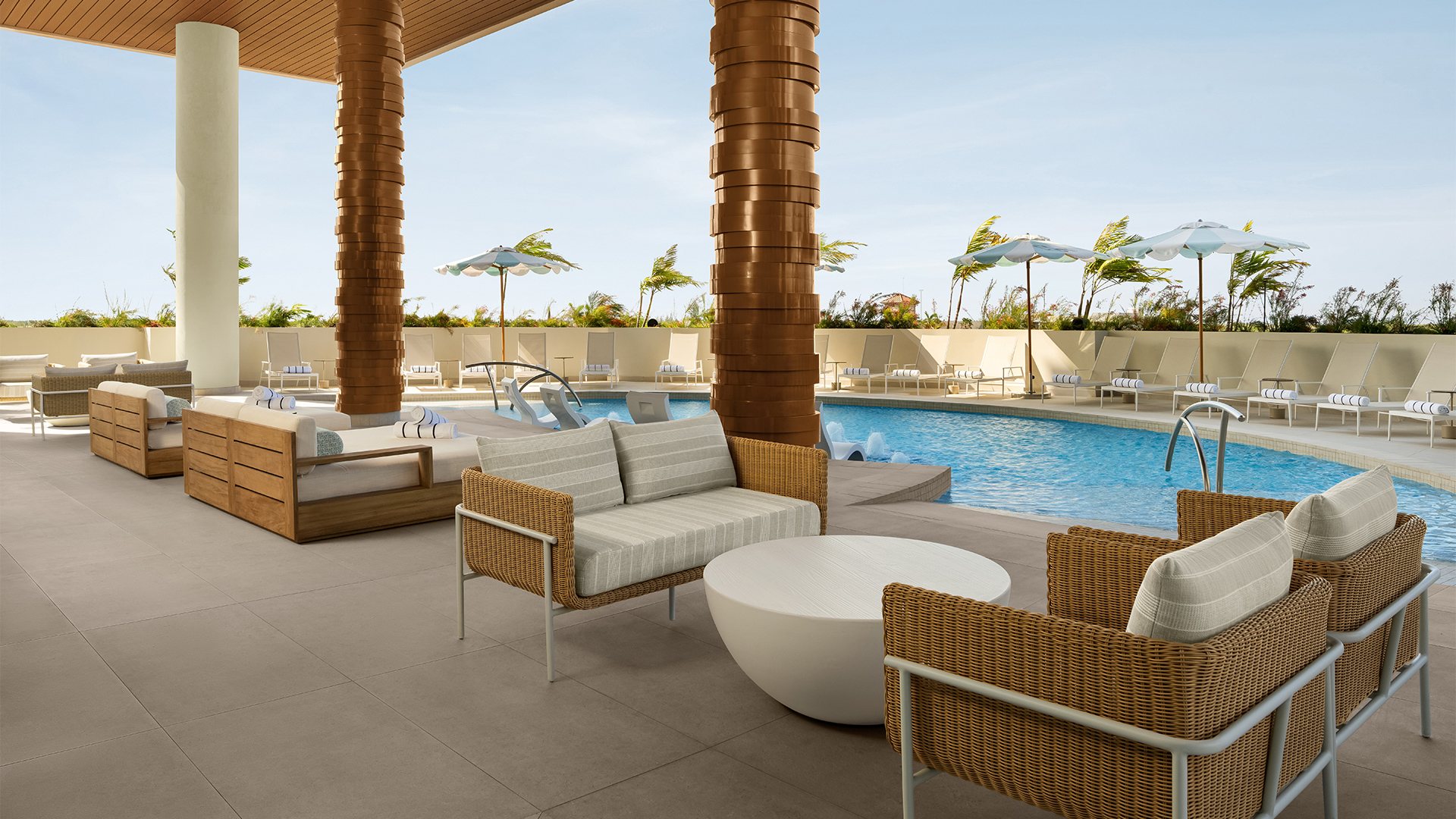 a pool with chairs and a table