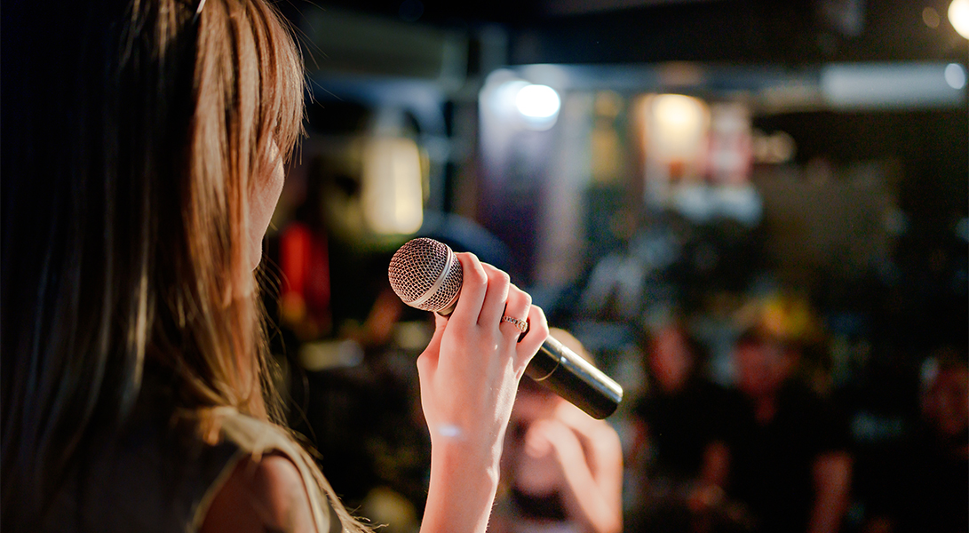 a woman holding a microphone