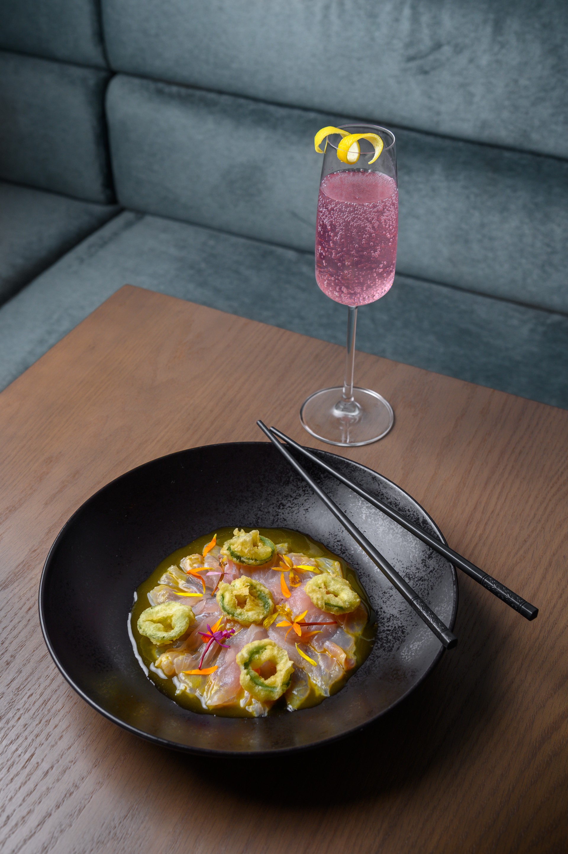 a plate of food and a glass of pink drink