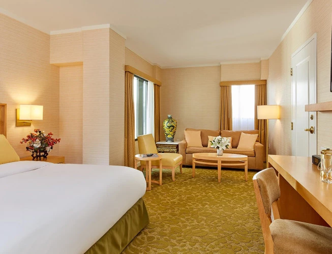 Junior suite with king bed and sitting areaJunior Suite