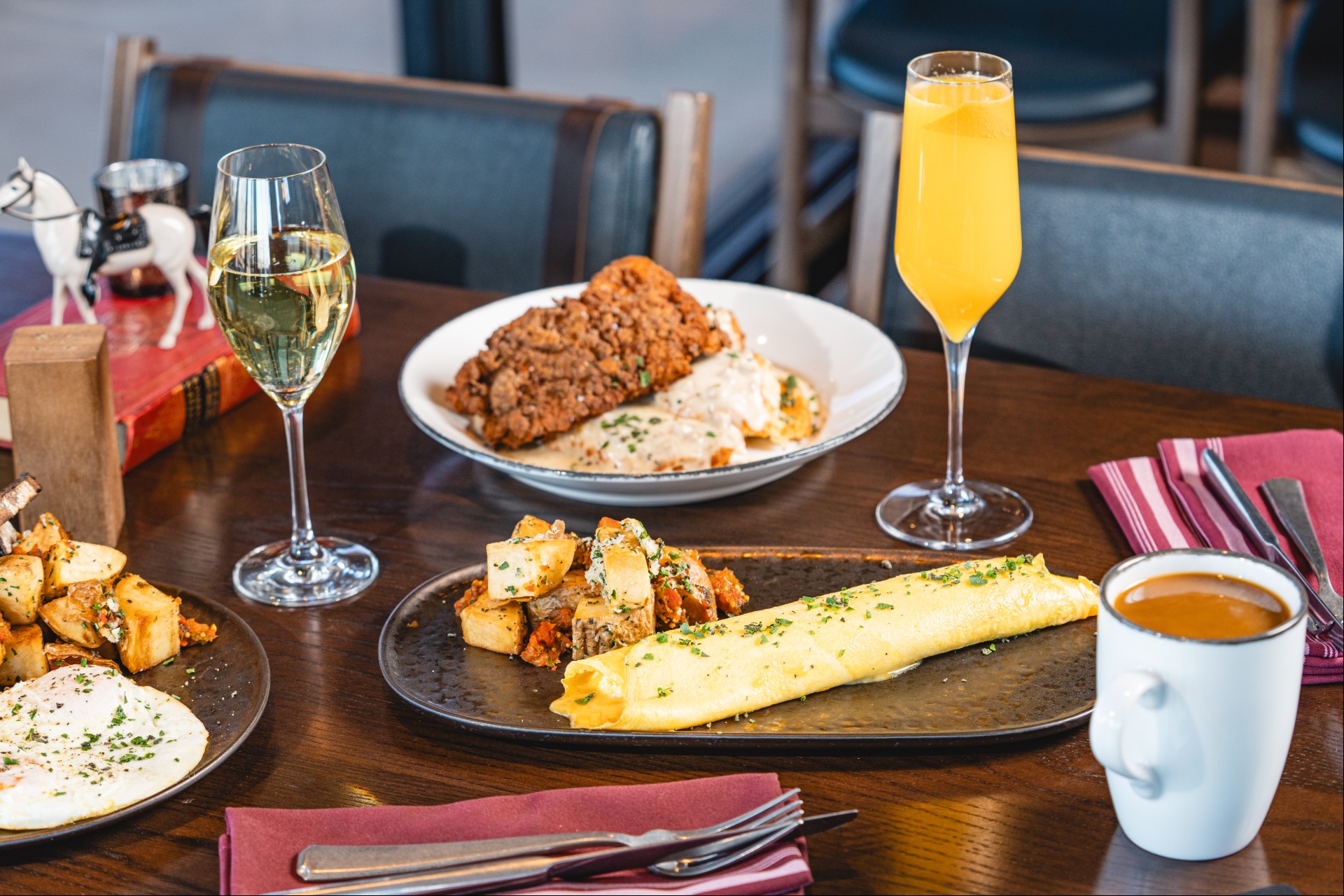 a table with plates of food and drinks