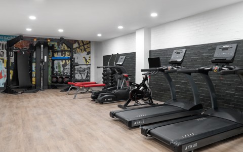 a room with treadmills and exercise equipment