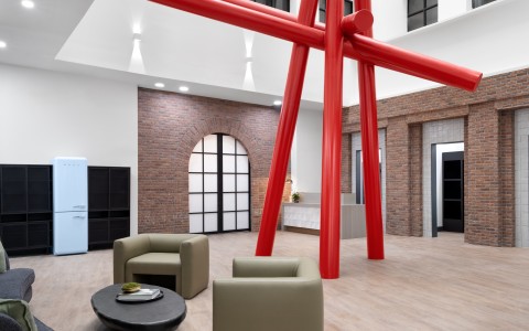 a room with a large red sculpture