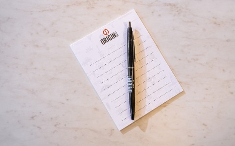 a pen on a piece of paper