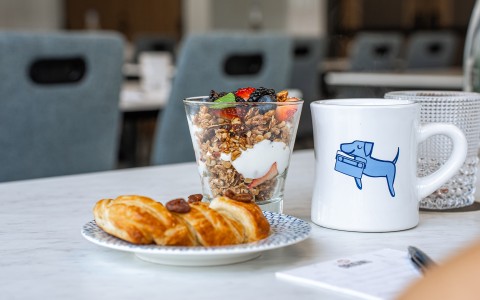 a cup of coffee and a dessert on a plate