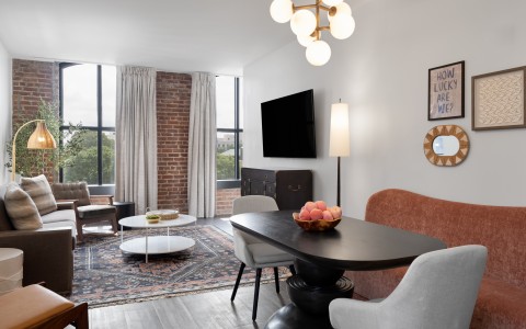 a living room with a table and chairs