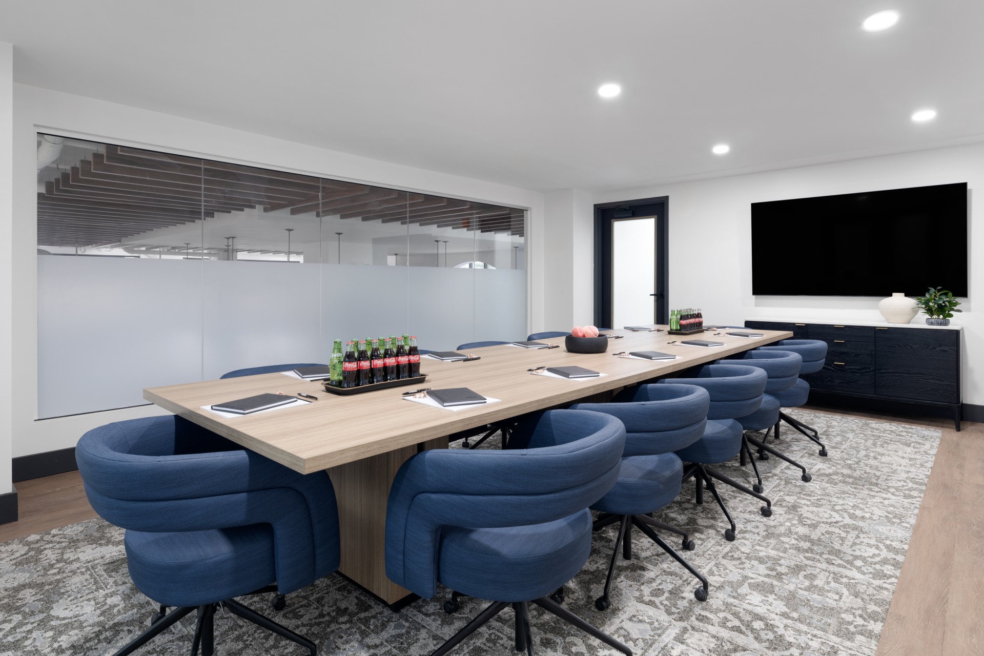 a conference room with a table and chairs