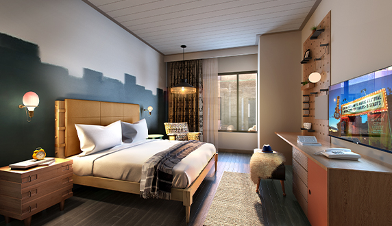 a bedroom with a bed and a desk