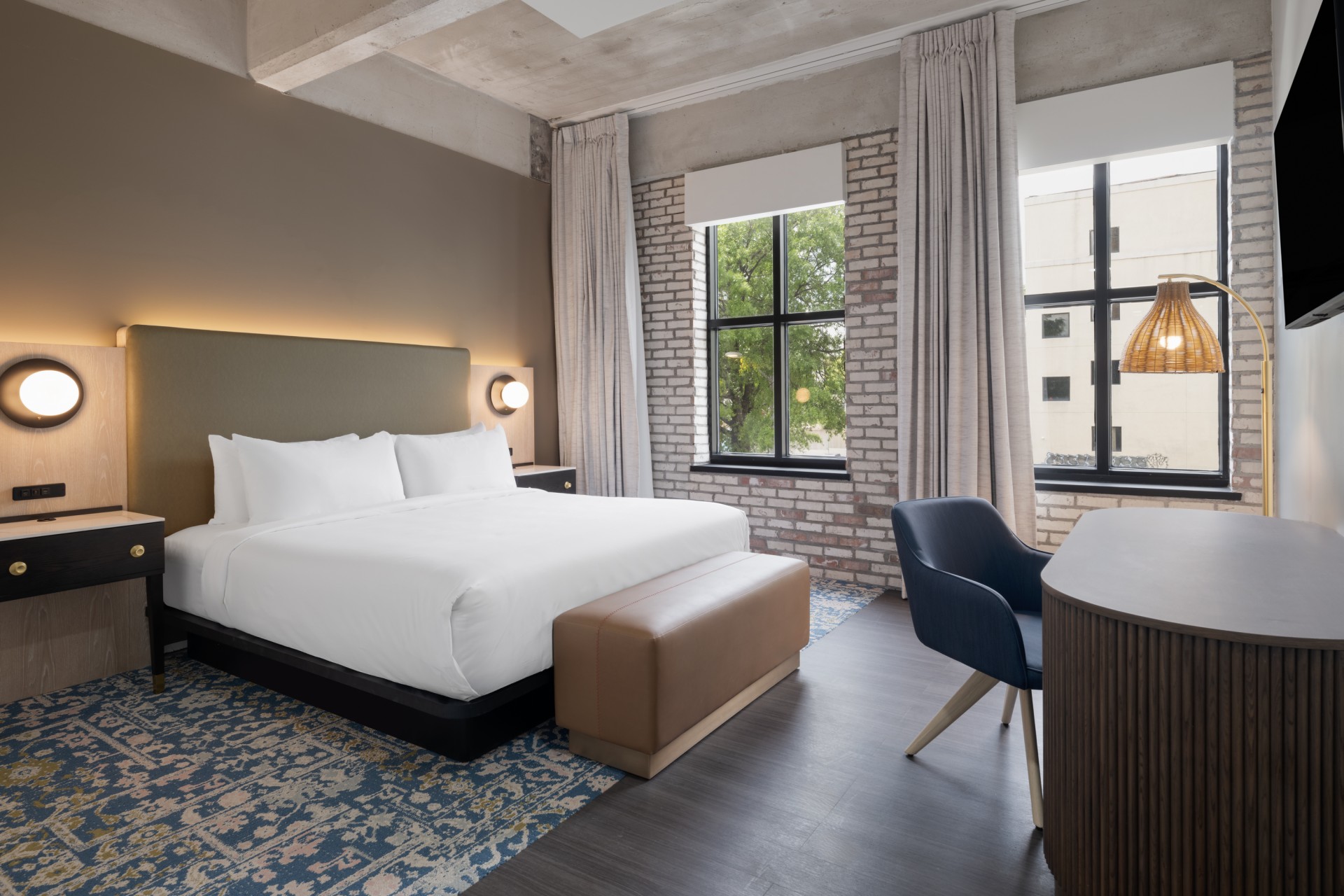 a room with a bed and a chair