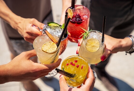 a group of people holding drinks