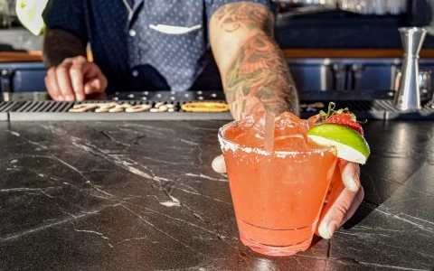bartender handing drink