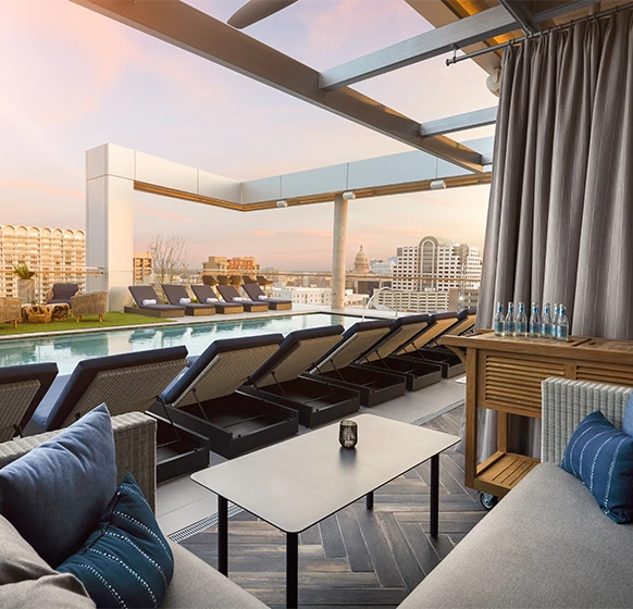 a pool with chairs and a table