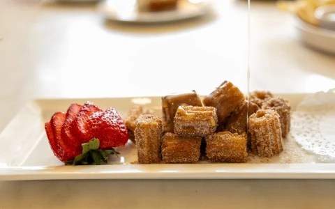a plate of food with a strawberry