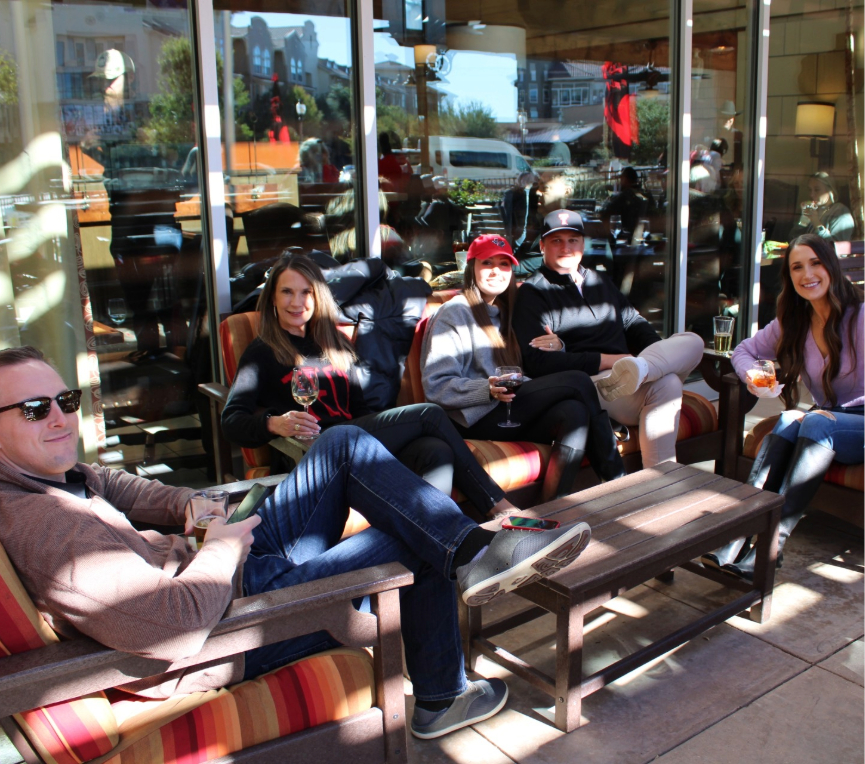 a group of people sitting on a bench