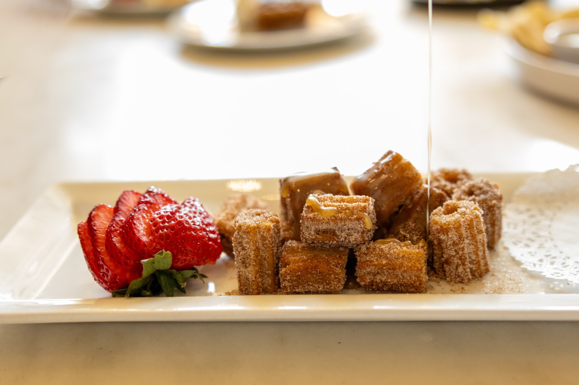 a plate of food with a strawberry