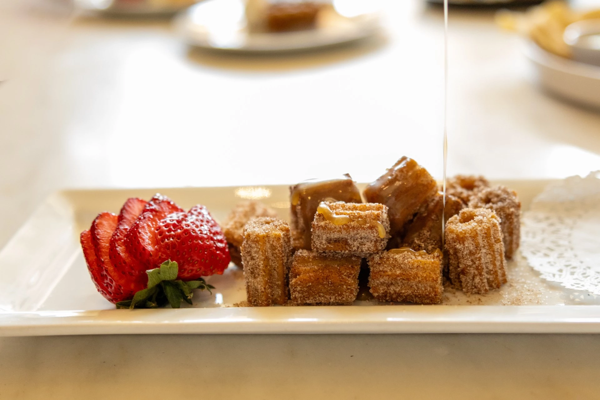a plate of food with a strawberry