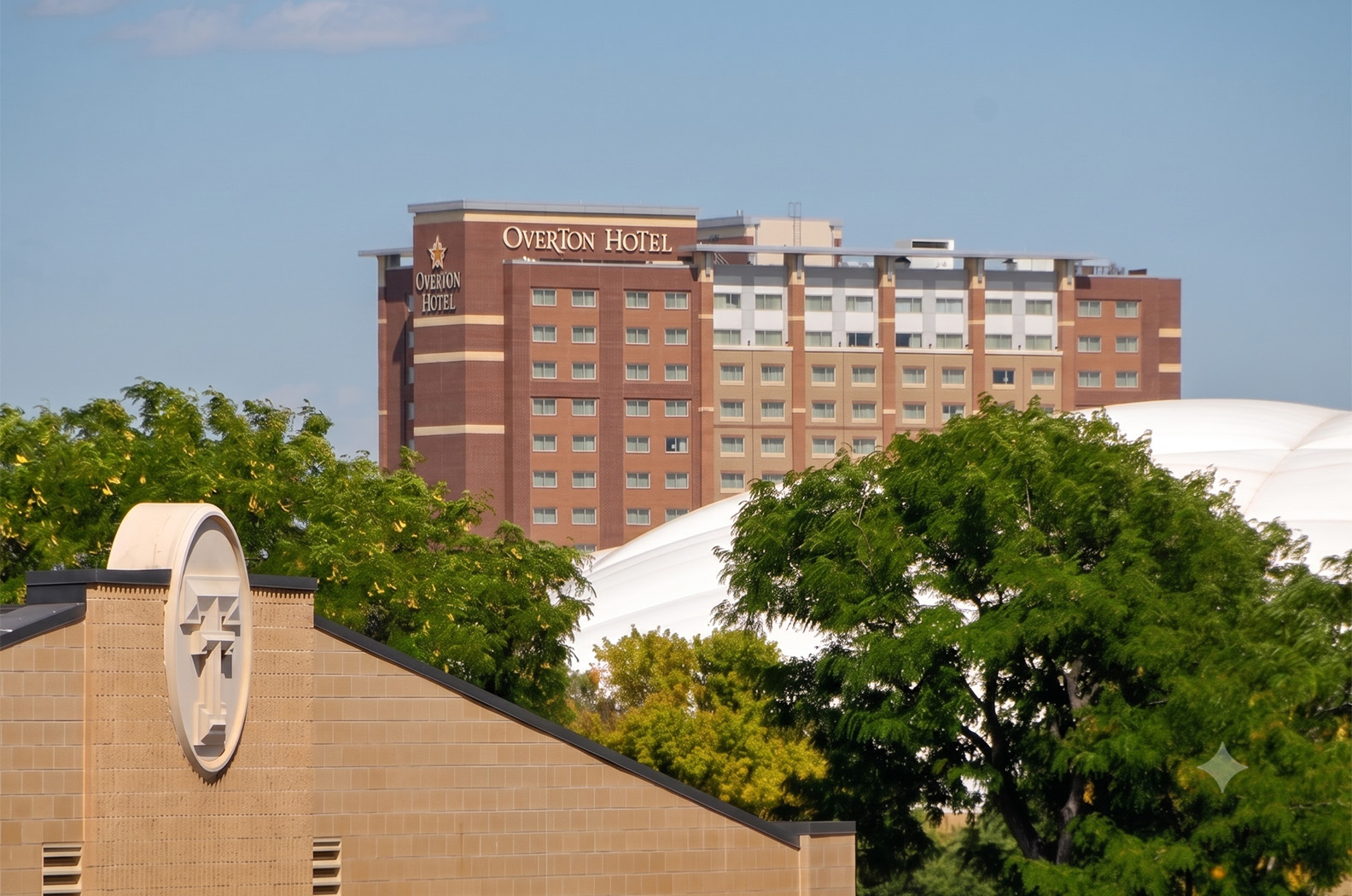 a large building with a clock in the background
