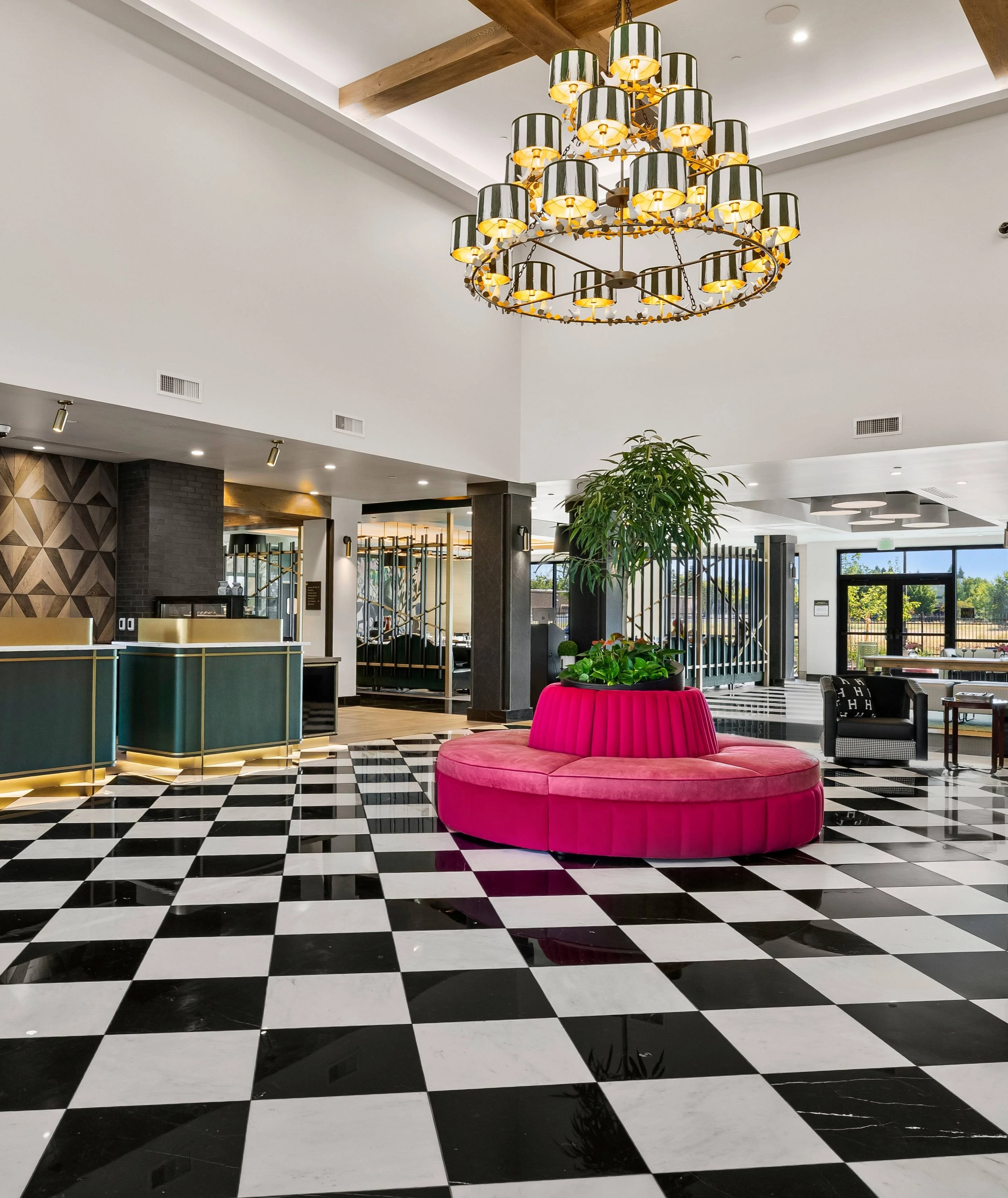 a black and white checkered floor with a pink couch