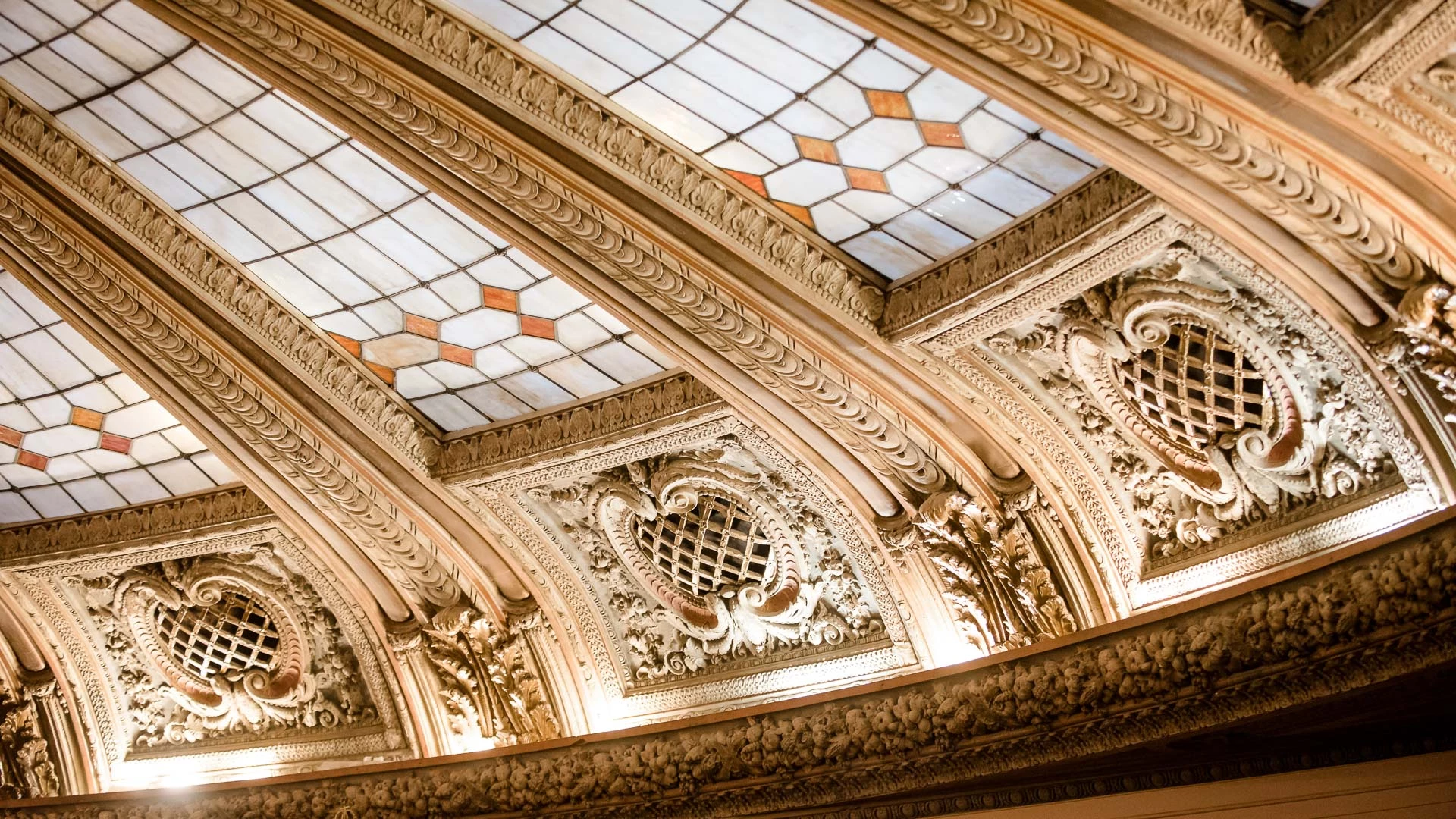 a ceiling with stained glass windows