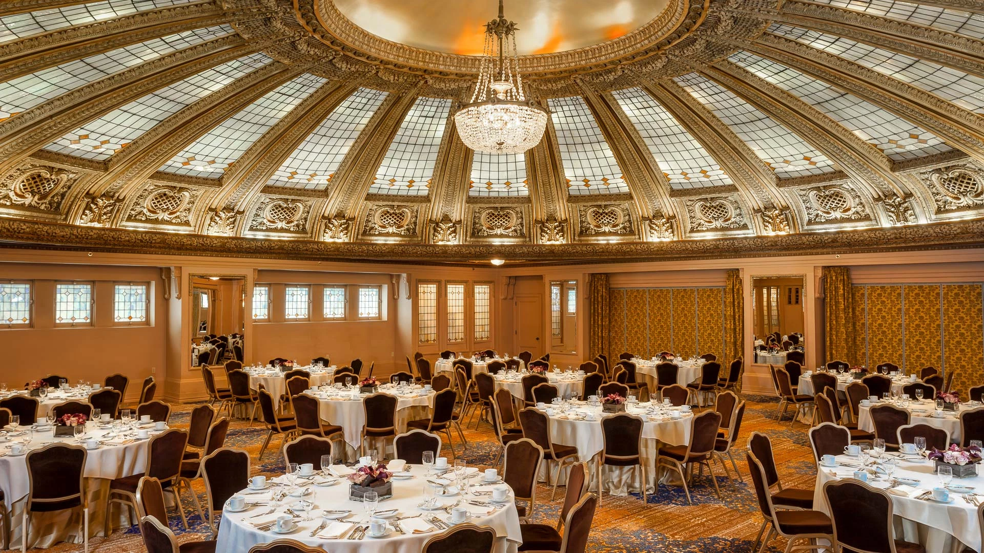 a room with round tables and chairs