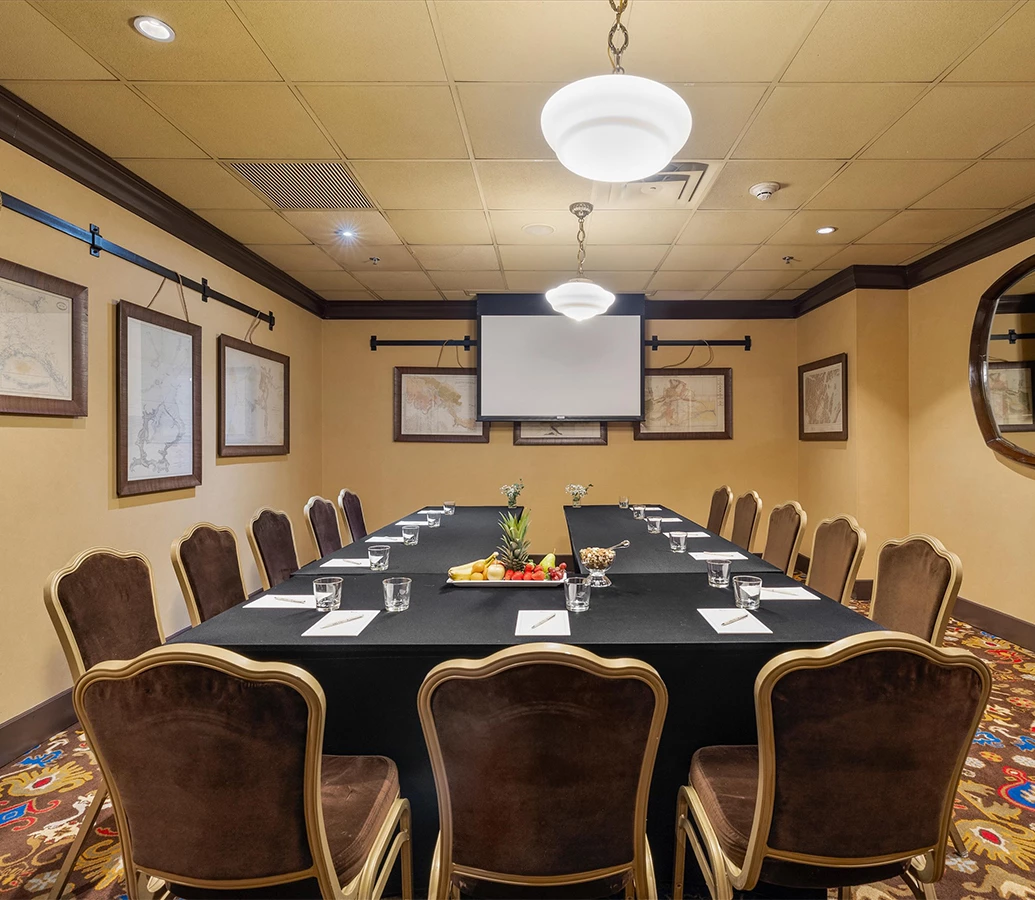 a conference room with a table and chairs